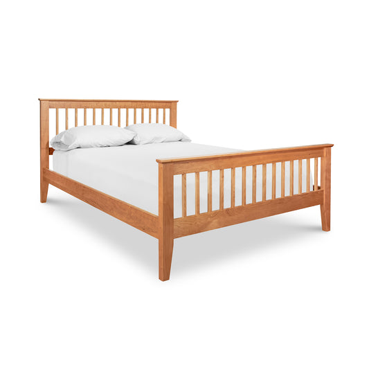 A high-quality American Mission Bed from Lyndon Furniture with white sheets on it, featuring a Mission-style design.
