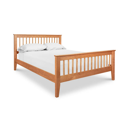 American Mission Bed by Lyndon Furniture with classic slat-frame design, shown with white mattress and pillows.