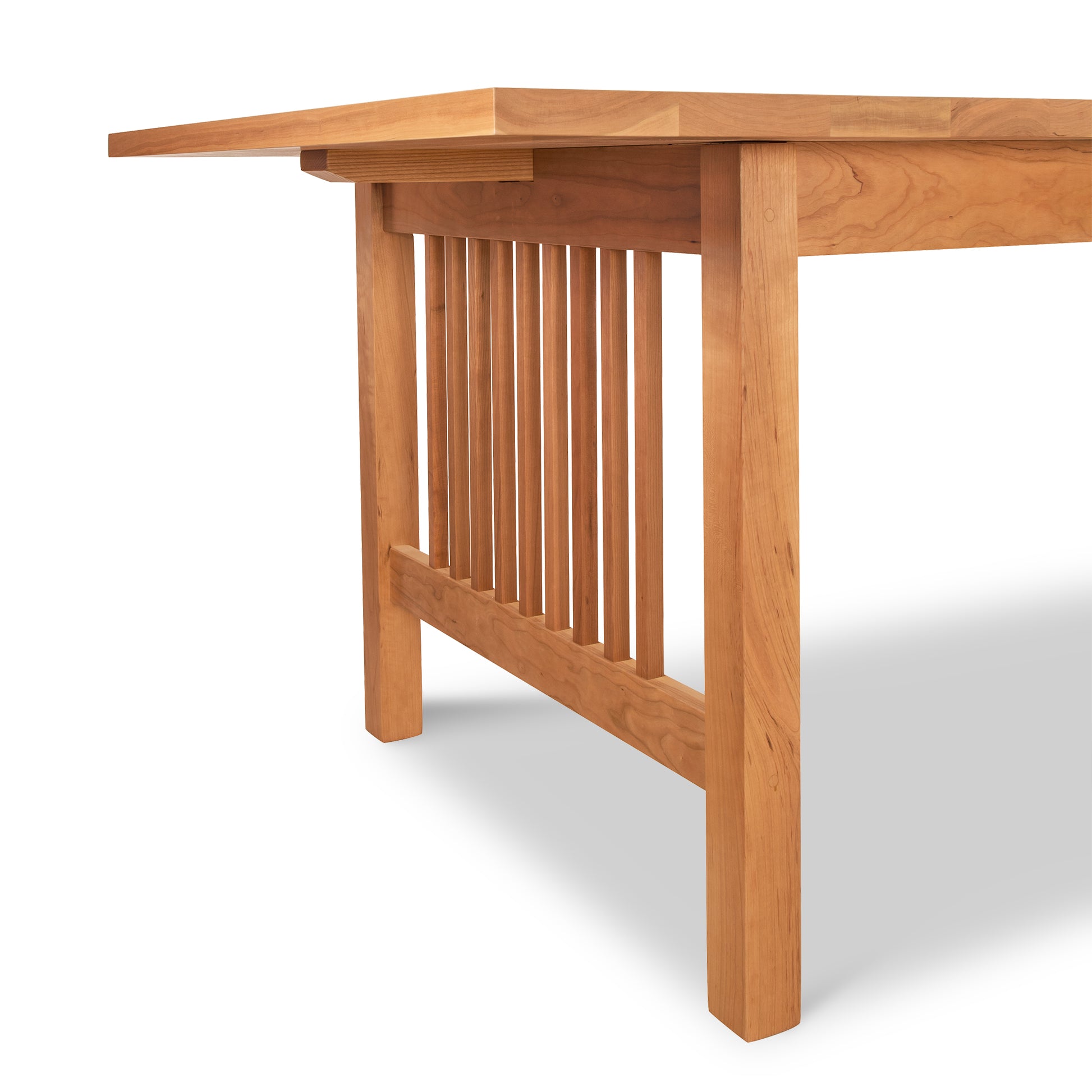 A solid natural wood American Mission Extension dining table with a wooden top by Lyndon Furniture.