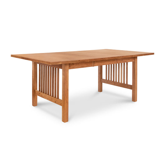Solid wood American Mission Extension Dining Table with rectangular top and slatted legs by Lyndon Furniture, perfect for dining or meetings.