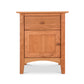 A Maple Corner Woodworks American Shaker 1-Drawer Nightstand with Door, crafted in the American Shaker style with a single drawer and a cabinet, made from sustainably harvested light cherry wood, photographed against a white background.