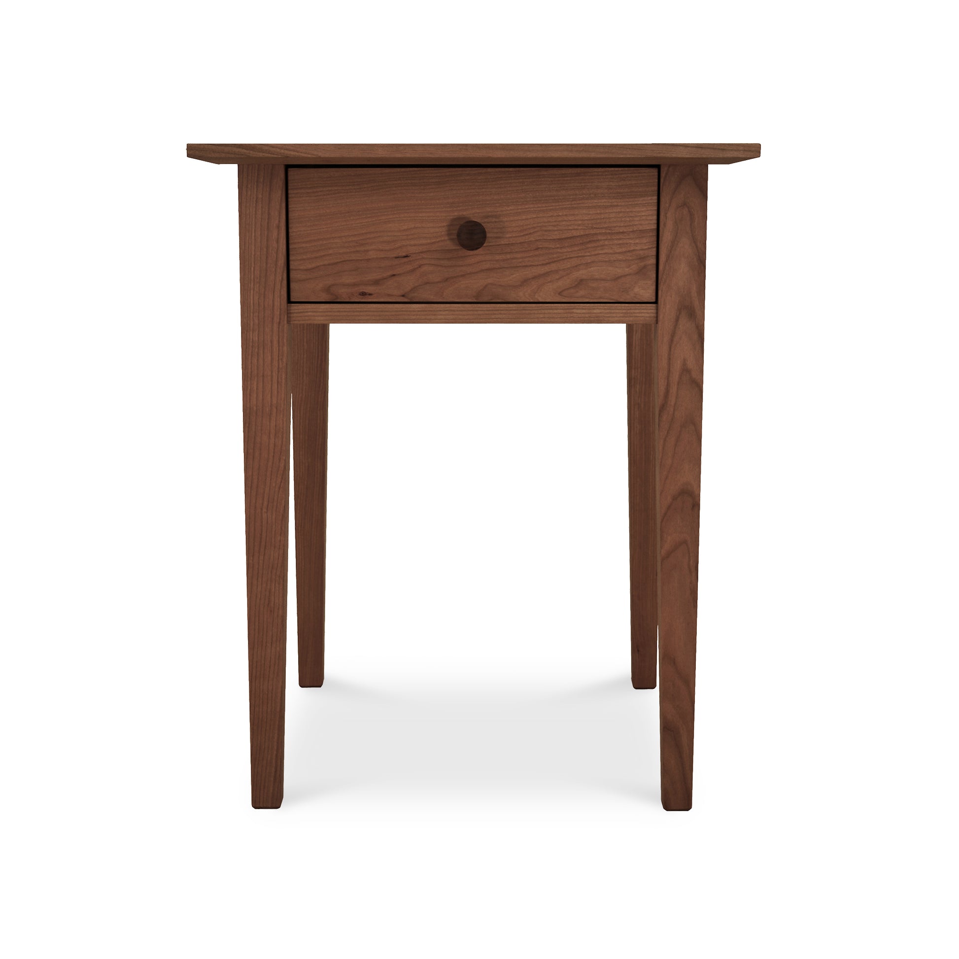 A simple wooden end table with a single drawer, featuring a round knob and a smooth finish, isolated on a white background is transformed into an Maple Corner Woodworks American Shaker 1-Drawer Nightstand.