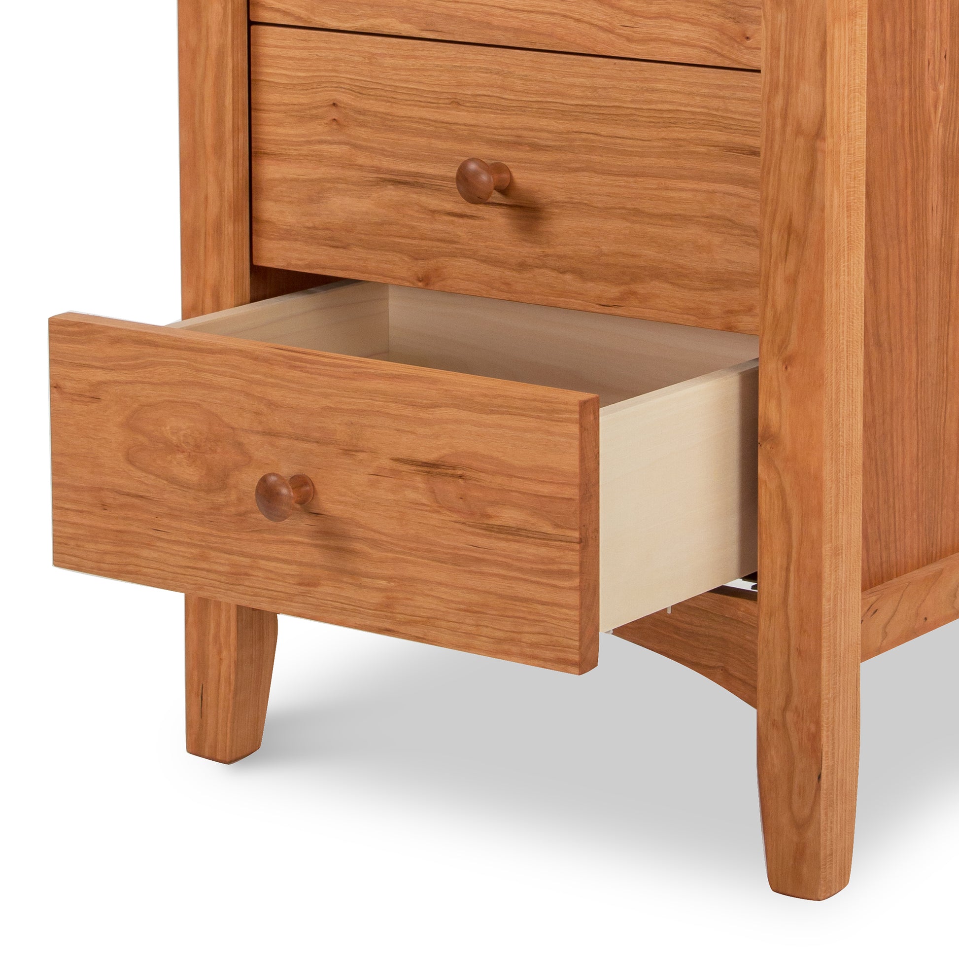 American Shaker 3-Drawer Nightstand - Display Model by Maple Corner Woodworks. Made from natural hardwoods, this Vermont-crafted nightstand features three drawers with round wooden knobs on four sturdy legs. Perfect for your solid wood, American made furniture collection with a beautiful natural finish. Ideal for fans of cherry wood, maple wood, or walnut wood furniture that combines style and functionality.