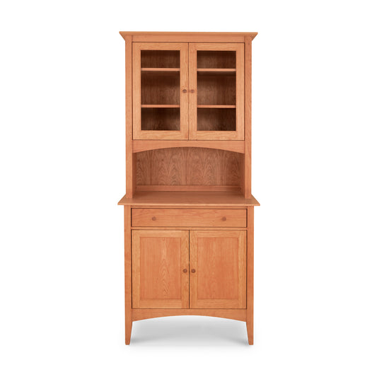This Maple Corner Woodworks American Shaker Small 38" China Cabinet features a glass door, perfect for displaying fine china and dishware. With its solid hardwood construction, this wooden hutch is both stylish and durable.