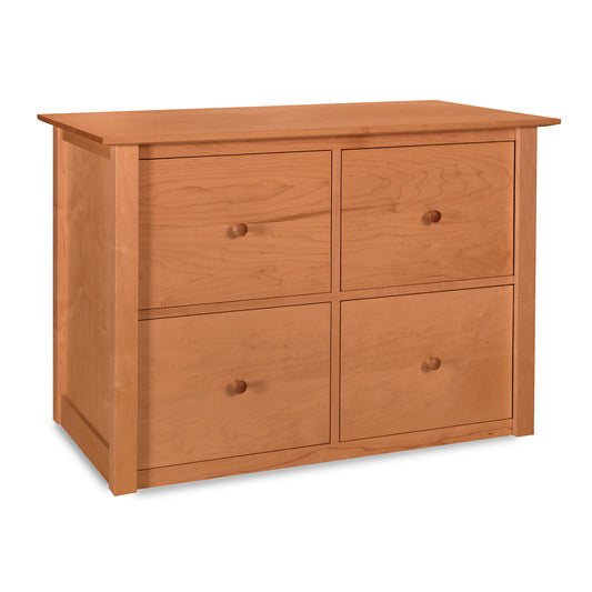 A four-drawer American Shaker File Credenza by Maple Corner Woodworks, inspired by the American Shaker style, featuring a flat top and round knobs on a plain background.
