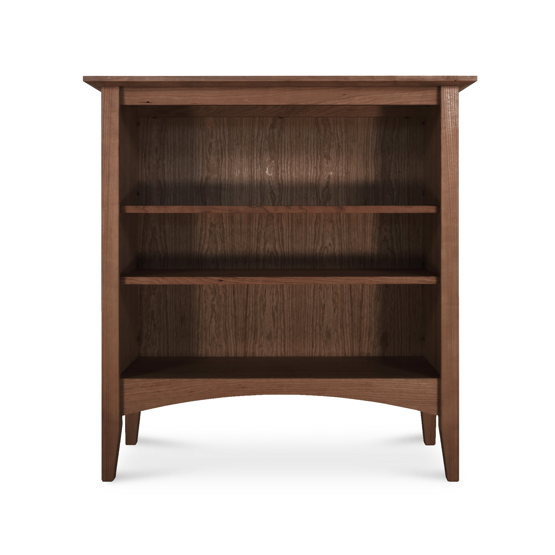 A Maple Corner Woodworks American Shaker bookcase made of sustainably harvested hardwoods, showcased on a white background.