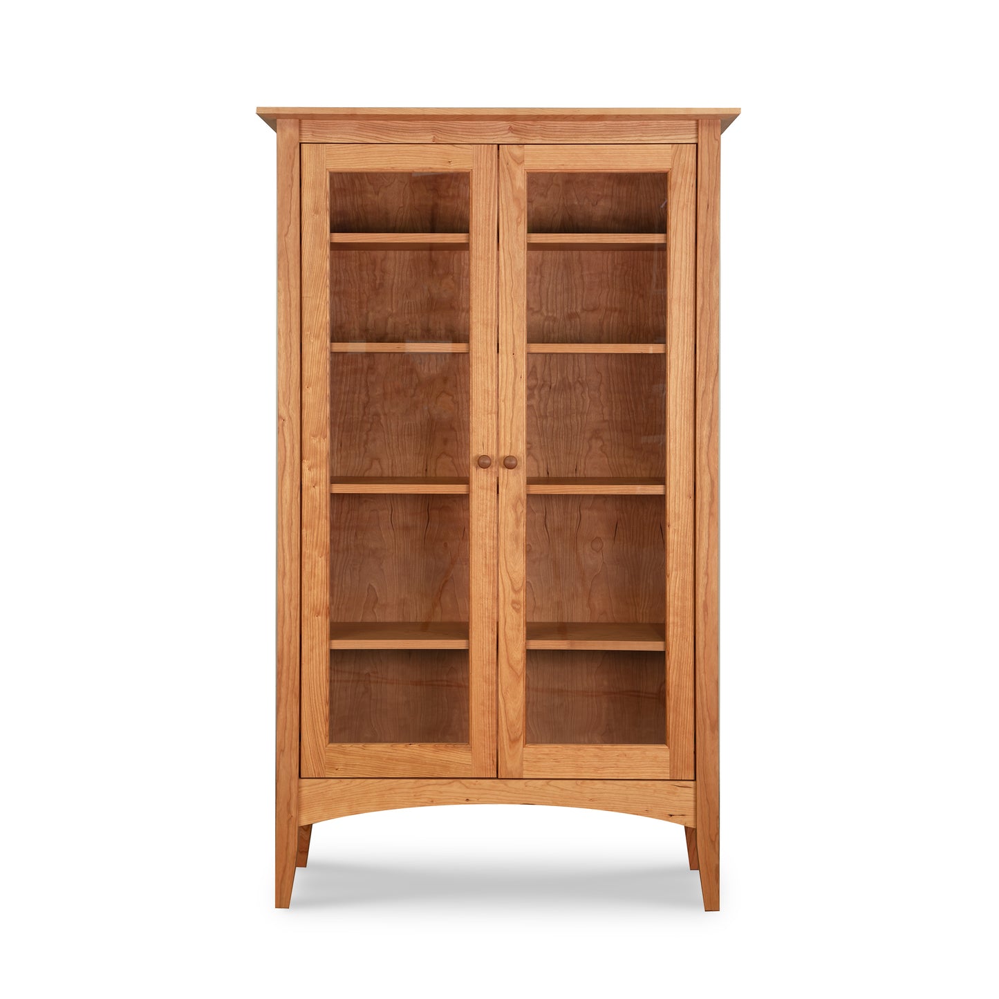 American Shaker Bookcase by Maple Corner Woodworks with glass doors, five shelves, and four sturdy legs; showcases fine Vermont craftsmanship.
