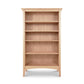 An American Shaker Bookcase by Maple Corner Woodworks, made from sustainably harvested hardwood, on a white background.