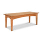 An American Shaker Coffee Table by Maple Corner Woodworks with a natural cherry top and legs.