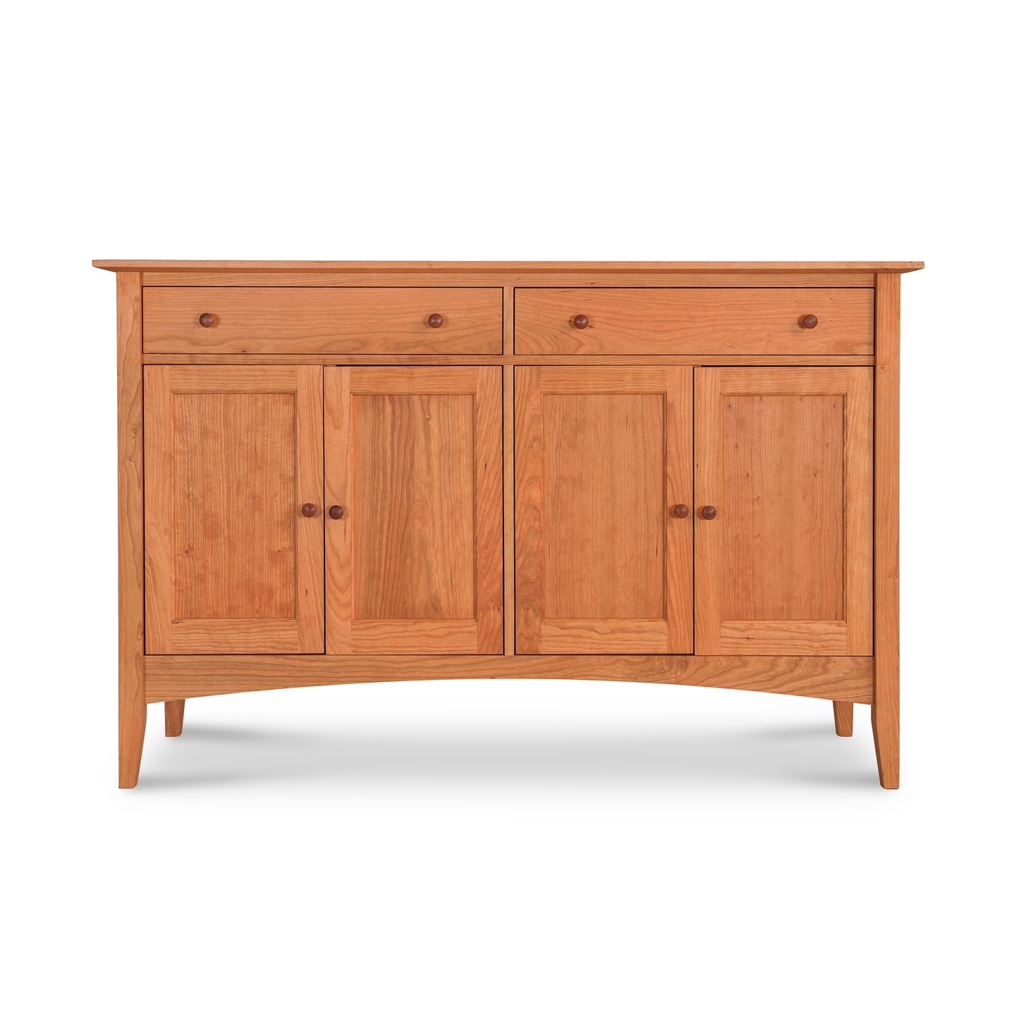 The American Shaker Large Sideboard by Maple Corner Woodworks is a stunning piece showcasing Vermont craftsmanship with its two drawers and double doors. Made from solid hardwood with a smooth finish, this sideboard stands on four straight legs and features light-colored wood in the classic Shaker style.