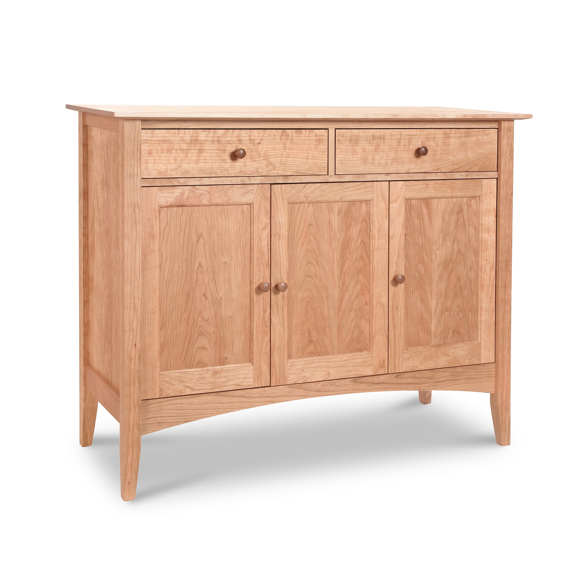 The American Shaker Medium Sideboard from Maple Corner Woodworks is crafted in Vermont and features a natural wood finish in solid hardwood, with a simple design that includes two drawers on top and three doors below, complemented by round knobs.