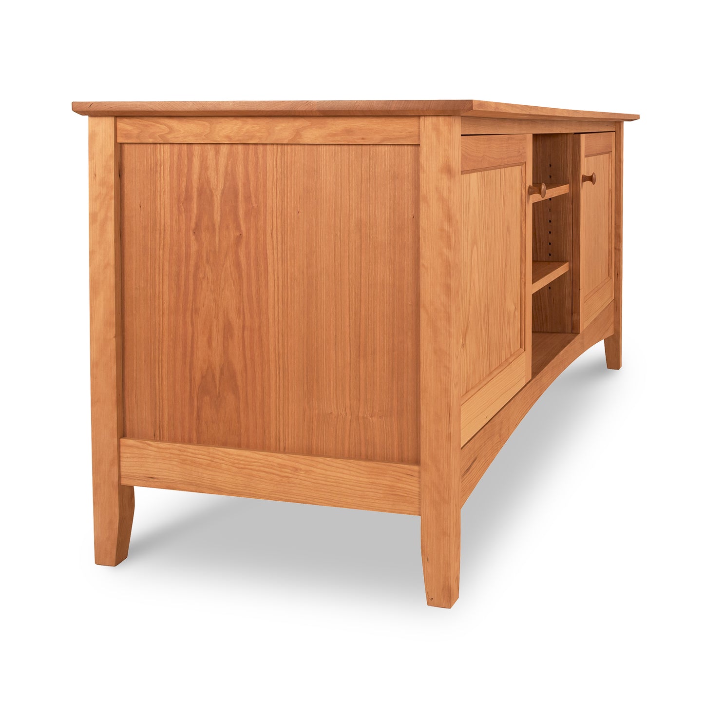 Maple Corner Woodworks American Shaker 67" TV Stand with cabinet doors partly open, revealing shelves inside, isolated on a white background, crafted from solid hardwoods.