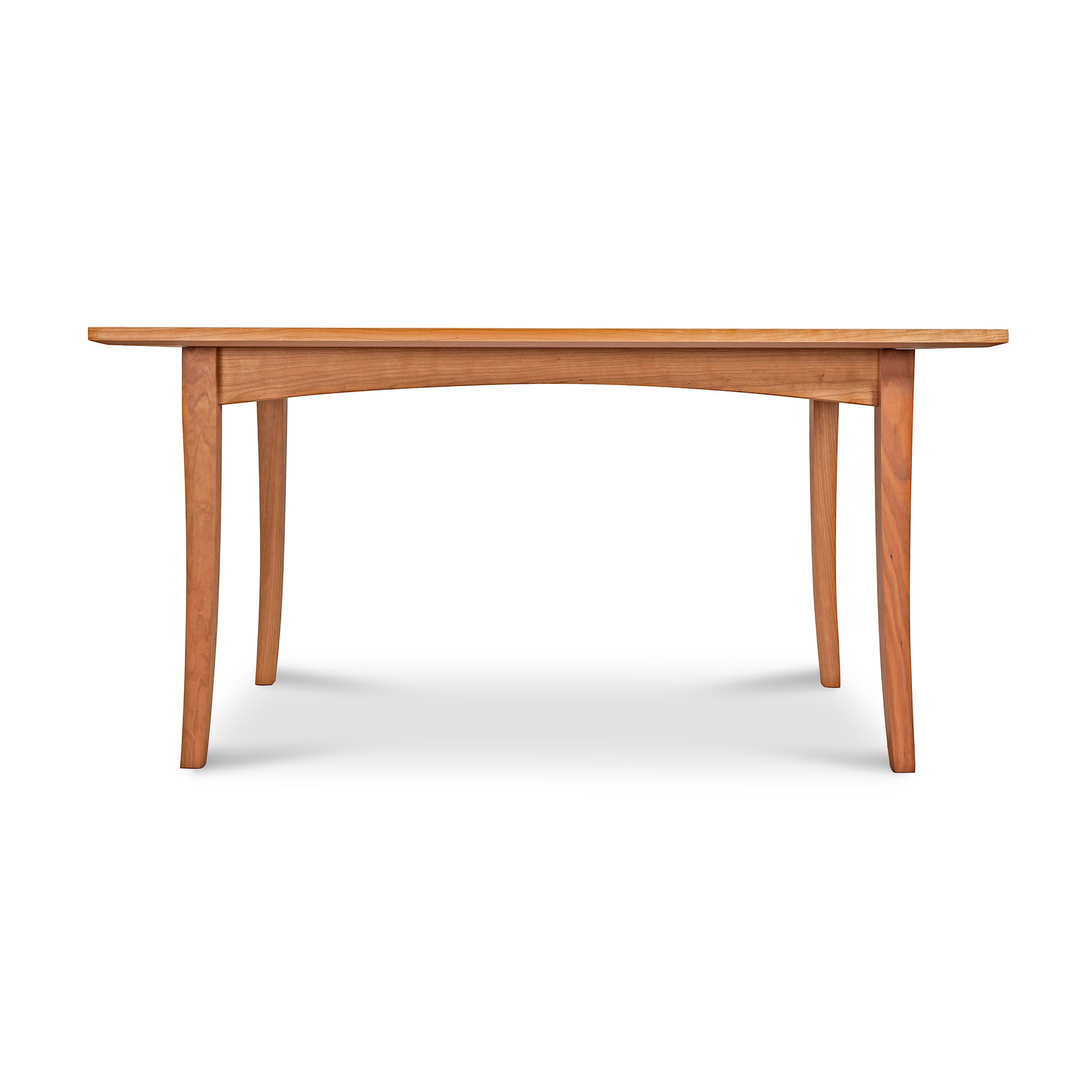 American Shaker Rectangular Solid Top Table by Maple Corner Woodworks featuring a handcrafted smooth rectangular surface and slightly curved legs, showcasing timeless elegance with its warm hardwood design.