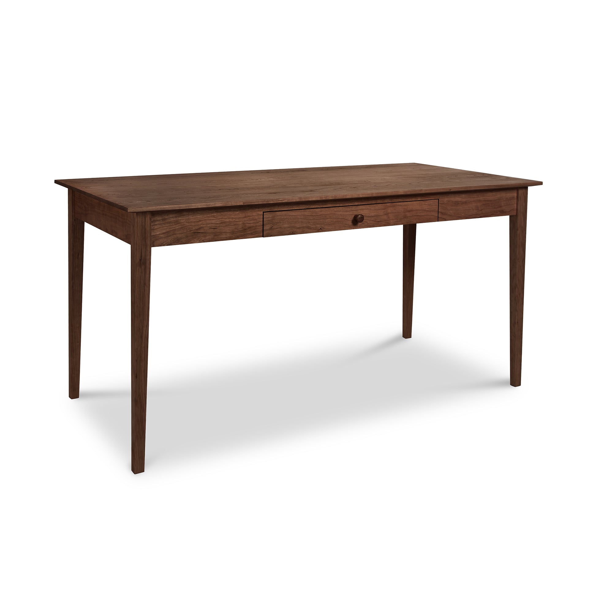 An Maple Corner Woodworks American Shaker writing desk, handmade from sustainably harvested hardwood, with a single drawer, set against a white background.