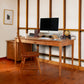 An American Shaker Writing Desk meticulously crafted by Vermont craftsmen from Maple Corner Woodworks fills the room.