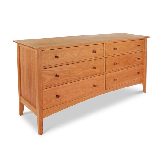 A Maple Corner Woodworks American Shaker 6-Drawer Dresser made from sustainable hardwoods, standing against a white background.