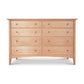A solid hardwood Maple Corner Woodworks American Shaker 8-Drawer Dresser showcasing exquisite craftsmanship, placed on a white background.