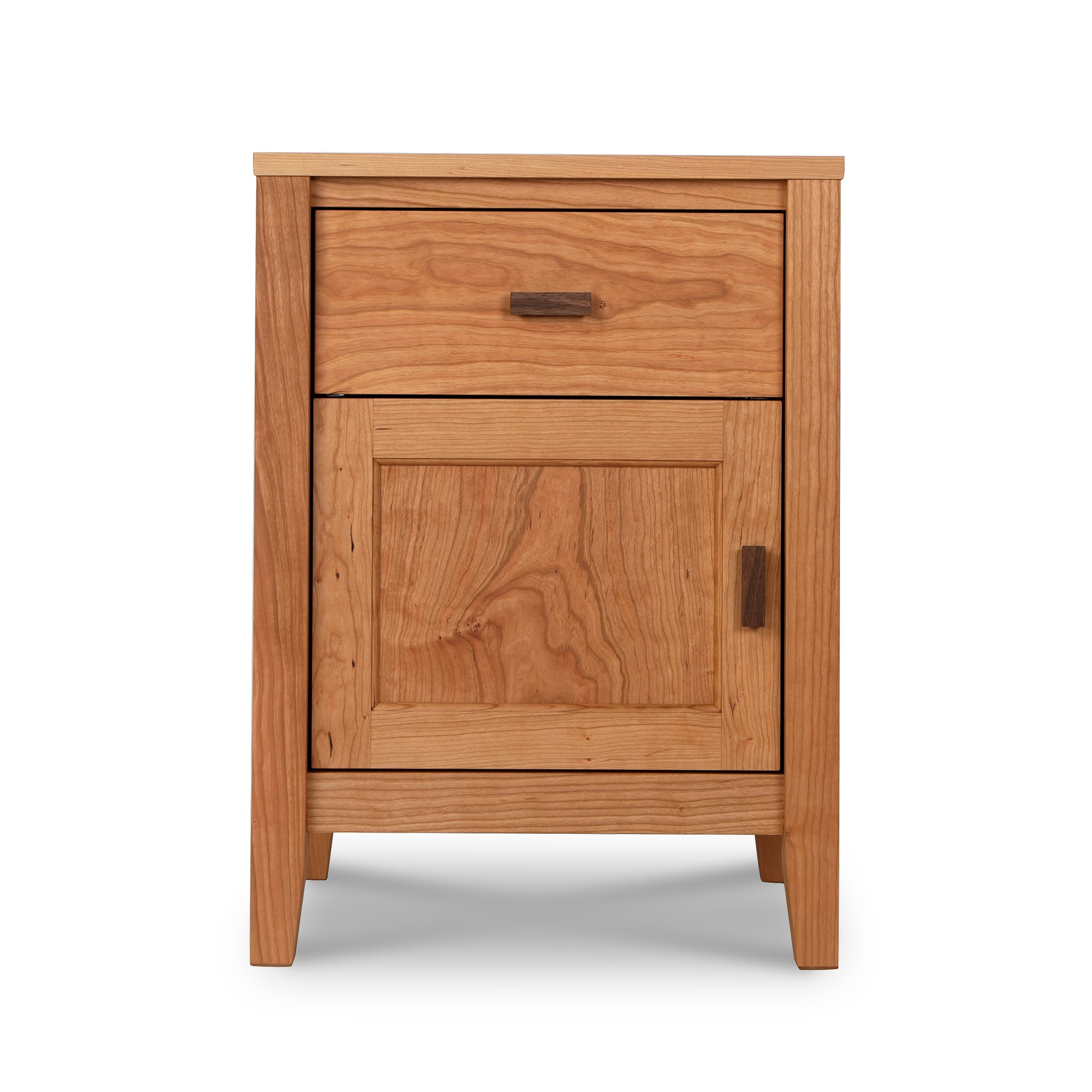 The Maple Corner Woodworks Andover Modern 1-Drawer Nightstand with Door is a stylish and compact nightstand made from sustainably sourced hardwoods.