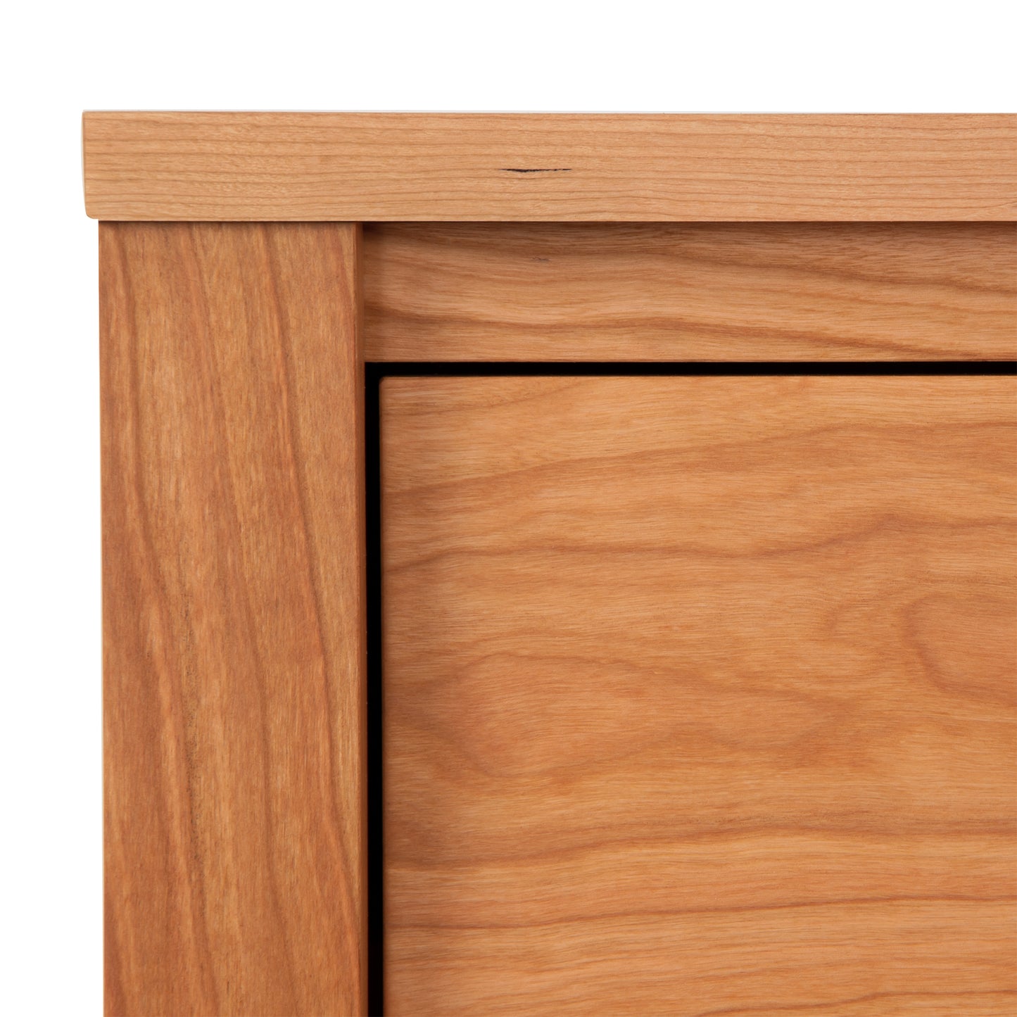 Close-up view of a Maple Corner Woodworks Andover Modern 1-Drawer Nightstand with Door, highlighting the wood grain and joints, emphasising the craftsmanship of Vermont woodworkers.