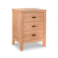 An eco-friendly Andover Modern 3-Drawer Nightstand by Maple Corner Woodworks with three drawers, each featuring a horizontal handle. The nightstand is presented against a plain white background, highlighting its natural wood finish.