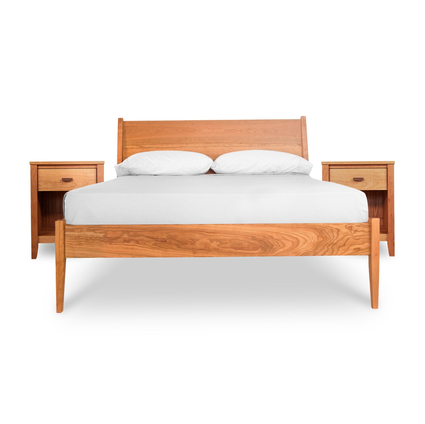 The Maple Corner Woodworks Andover Modern 3-Piece Bedroom Set - Ready to Ship features a solid wood incline bed with a striking wooden headboard. Showcased in the image, the bed includes a white mattress and two white pillows. Complementing the mid-century modern design are matching wooden bedside tables, each equipped with a single drawer and an additional shelf beneath.