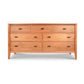The Maple Corner Woodworks Andover Modern 7-Drawer Dresser combines traditional flair with a modern design, showcasing a beautifully crafted wooden dresser with drawers.