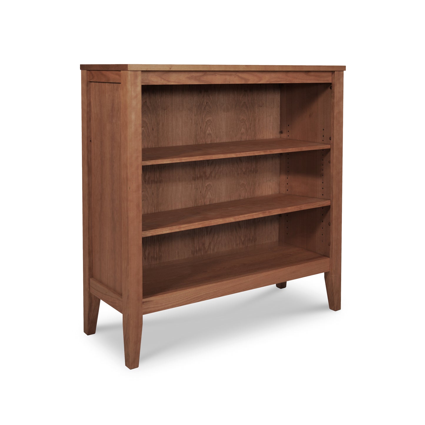 Andover Modern Bookcase by Maple Corner Woodworks featuring a medium brown finish, 3 shelves, tapered legs, and crafted from sustainable materials.