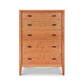 The Maple Corner Woodworks Andover Modern 5-Drawer Chest combines classic style with a modern look. Set against a white background, this wooden chest of drawers is an elegant addition to any space.