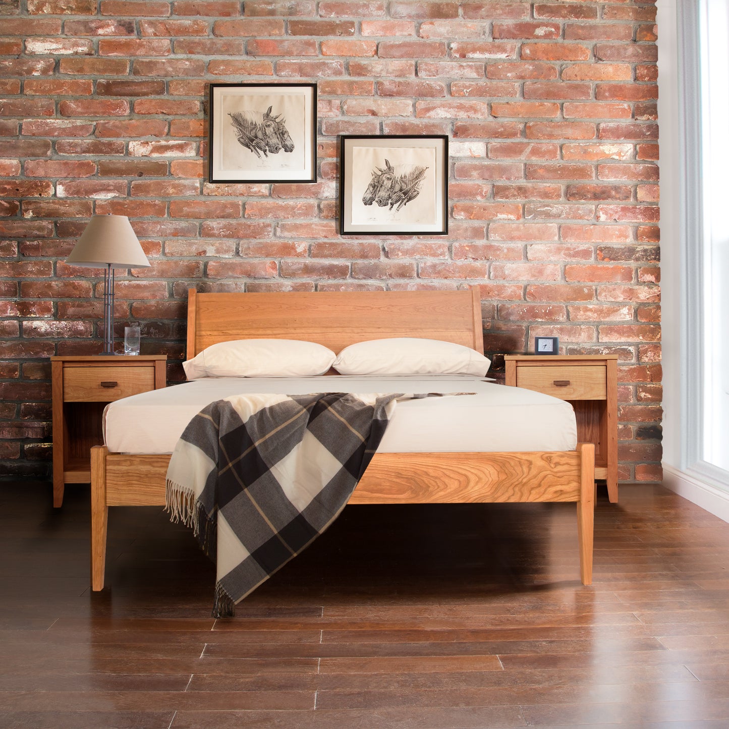 An Andover Modern Incline Bed from Maple Corner Woodworks in a room with a brick wall.