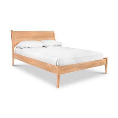 Andover Modern Incline Bed by Maple Corner Woodworks with mid-century solid wood frame and inclined headboard holding two white pillows.