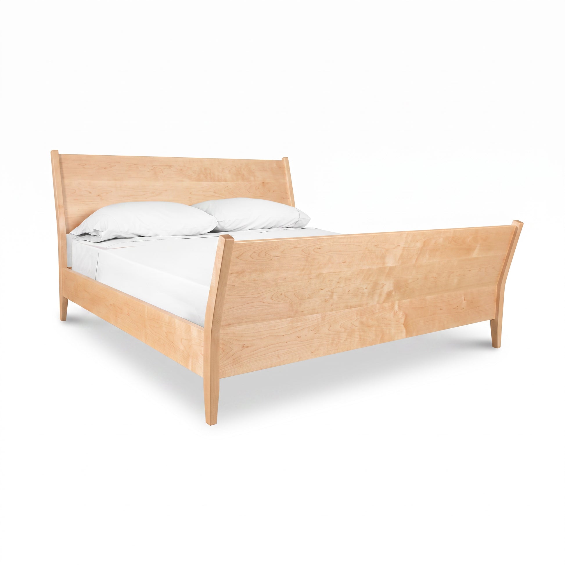 Maple Corner Woodworks Andover Modern Incline Sleigh Bed featuring a white mattress and two pillows, crafted in Vermont from solid wood.