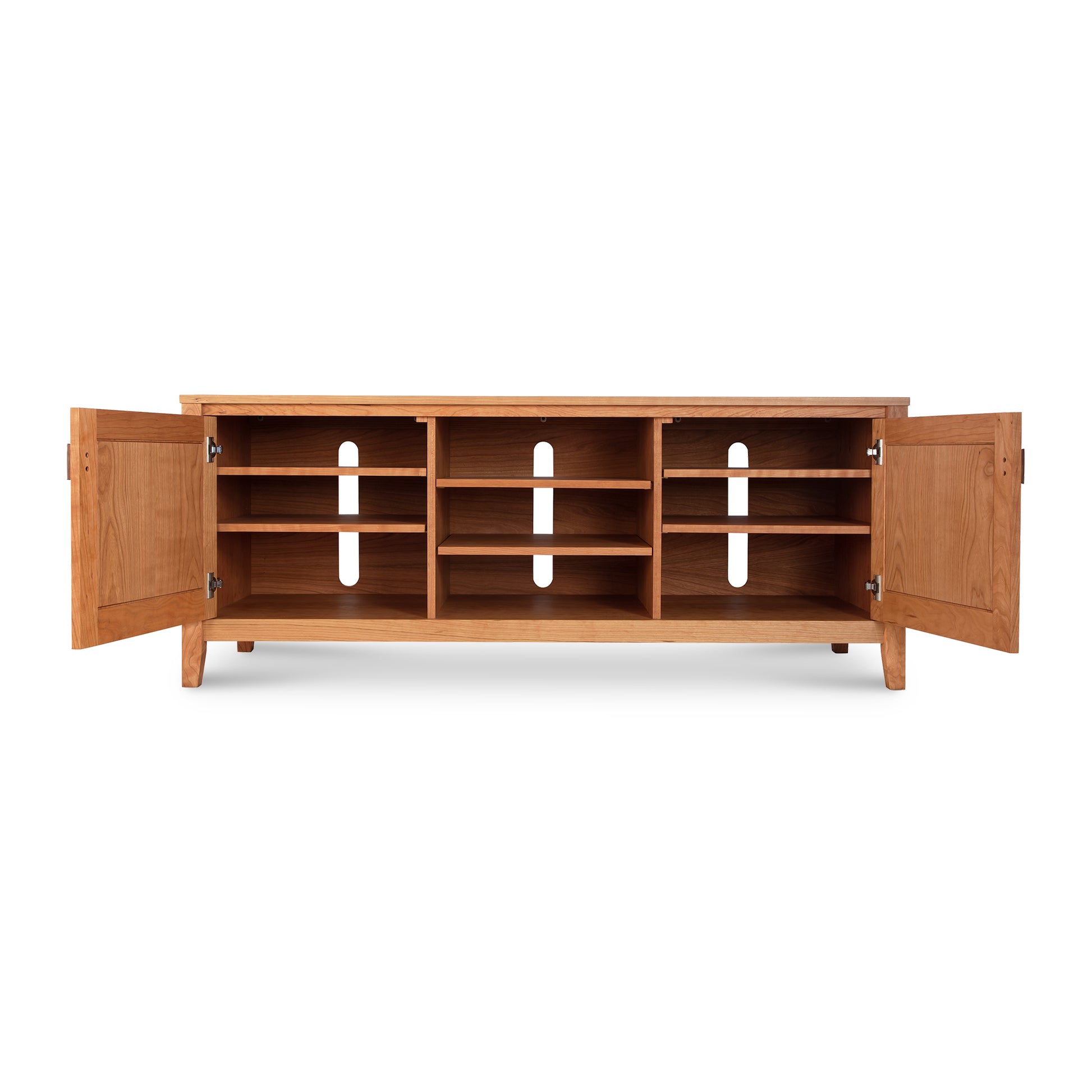 An Andover Modern 64" TV stand made by Maple Corner Woodworks, constructed of hardwood with shelves and drawers.