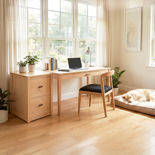 Andover Modern Writing Desk by Maple Corner Woodworks as the centerpiece, paired with a stylish chair in a naturally lit home office.