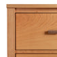 Andover Modern Sweater Chest by Maple Corner Woodworks shown in detail, highlighting the sleek metal drawer handle and fine wood craftsmanship.