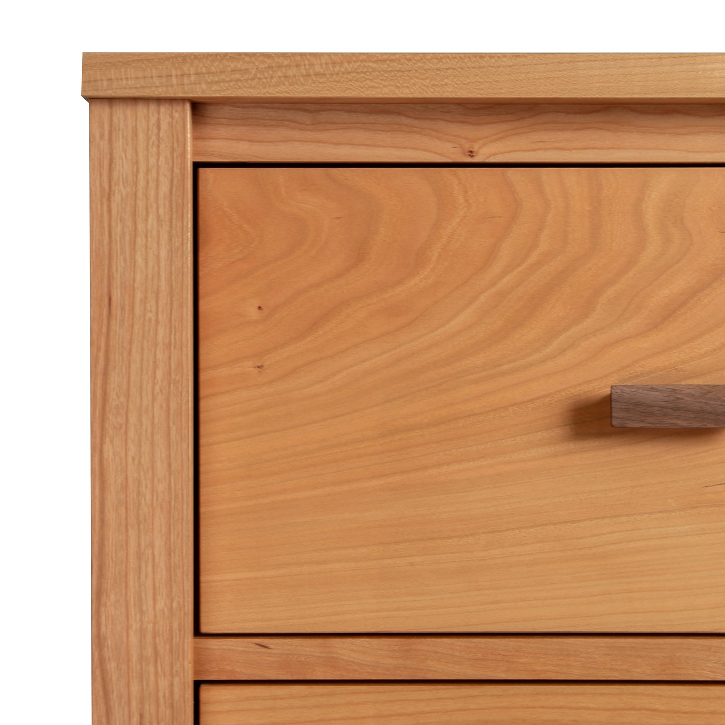 Andover Modern Sweater Chest by Maple Corner Woodworks shown in detail, highlighting the sleek metal drawer handle and fine wood craftsmanship.