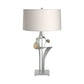 Antasia #2 Table Lamp by Hubbardton Forge with sculptural metallic base and white drum shade, showcasing elegant craftsmanship and modern design.
