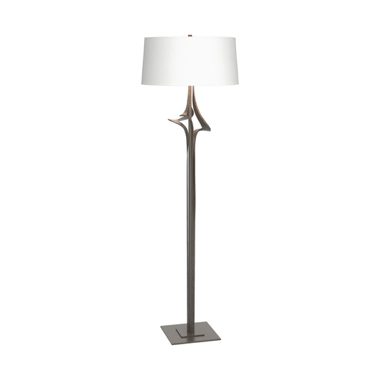 Antasia Floor Lamp by Hubbardton Forge with a white drum shade and sculptural soft gold base, showcasing modern American craftsmanship and elegant design.