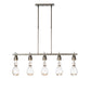An Apothecary Pendant chandelier with clear glass bulbs from Hubbardton Forge.