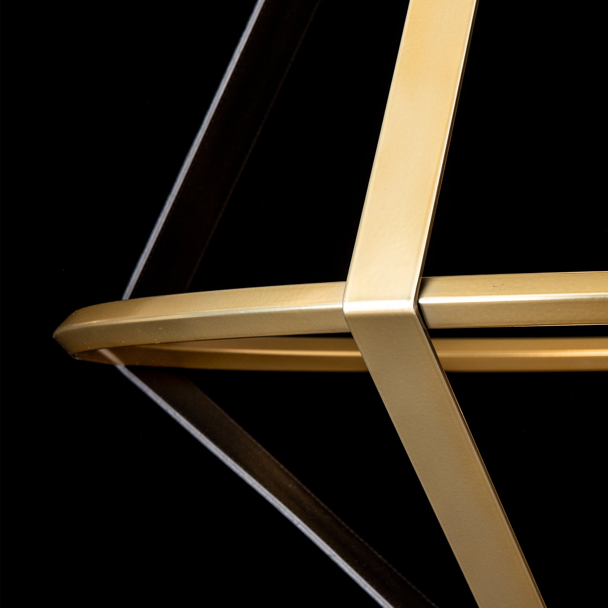 Detailed view of Hubbardton Forge's Aspen Large LED Lantern highlights its geometric gold frame and modern American-made craftsmanship.