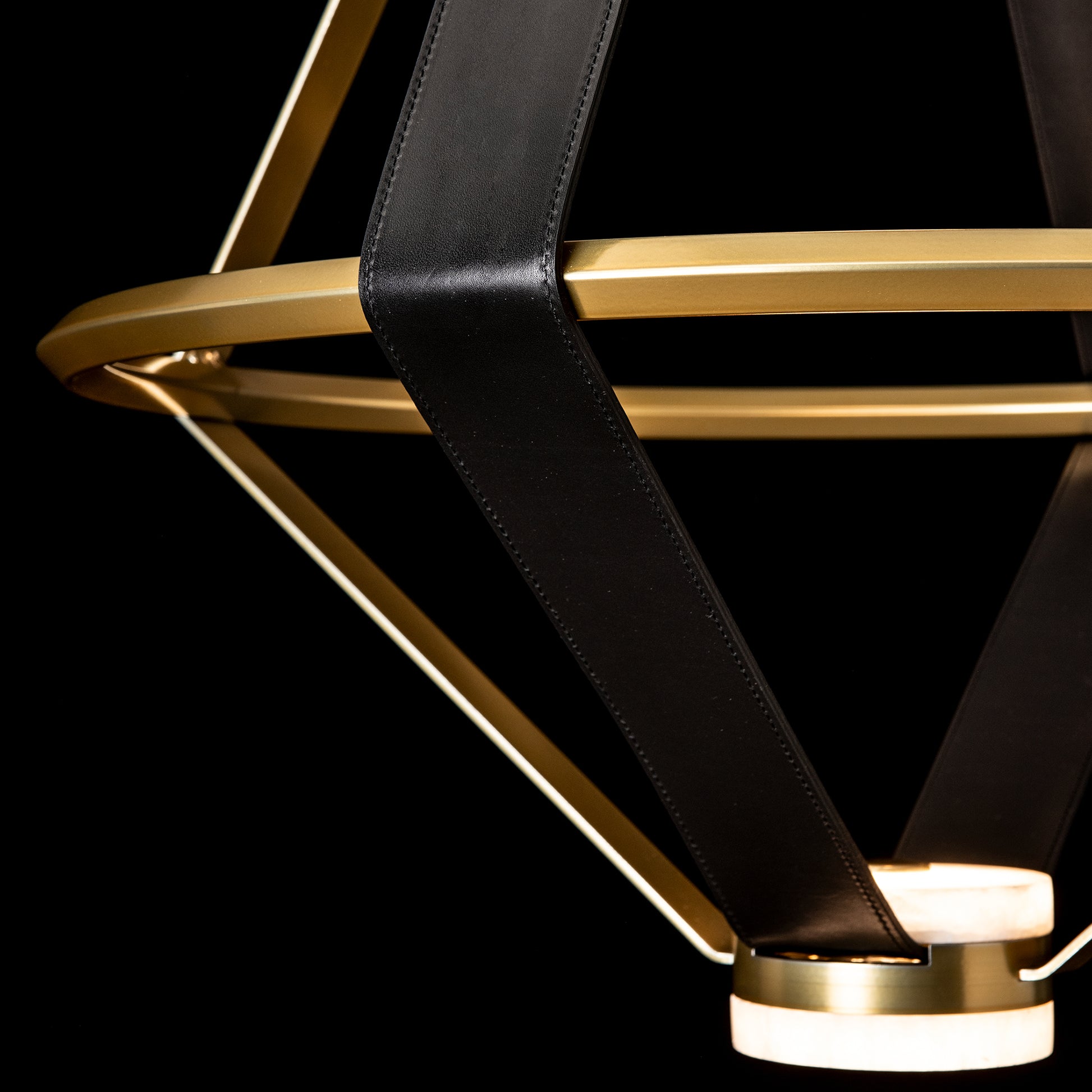 Hubbardton Forge Aspen Large LED Lantern featuring gold rings and black leather straps, showcasing fine American craftsmanship and modern design.