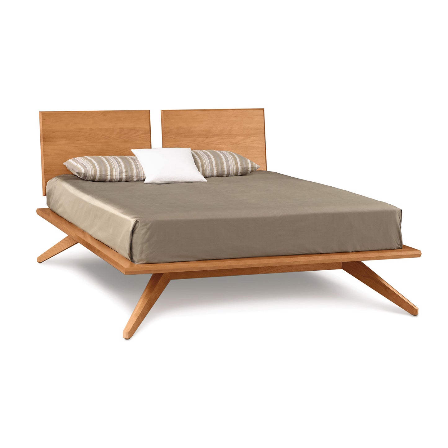 Mid-century modern Astrid Platform Bed with angled wooden frame by Copeland Furniture, featuring an eco-friendly double mattress and neutral bedspread.