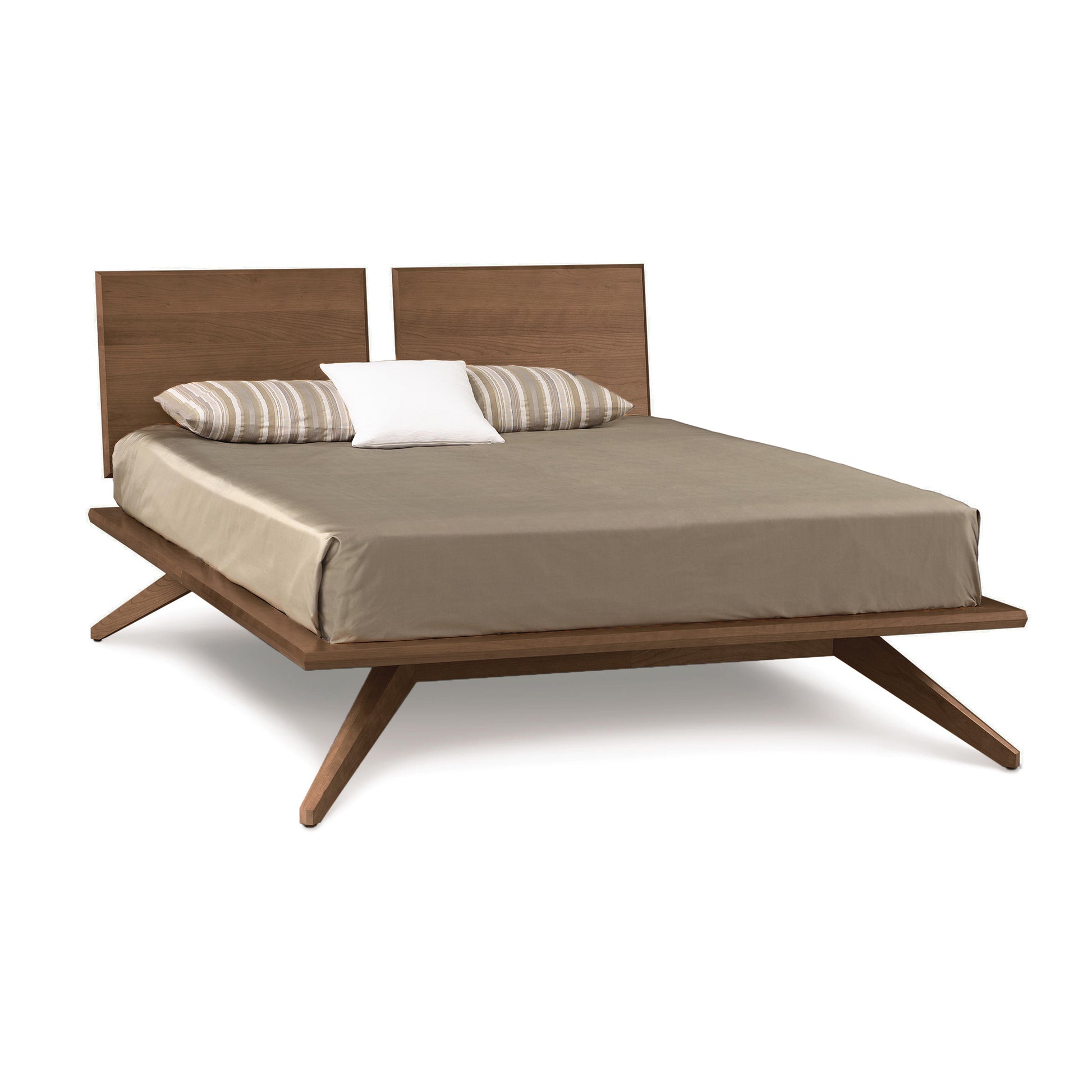 Astrid Platform Bed by Copeland Furniture with eco-friendly hardwood frame, brown headboard, and angled legs highlighted against neutral beige bedding.