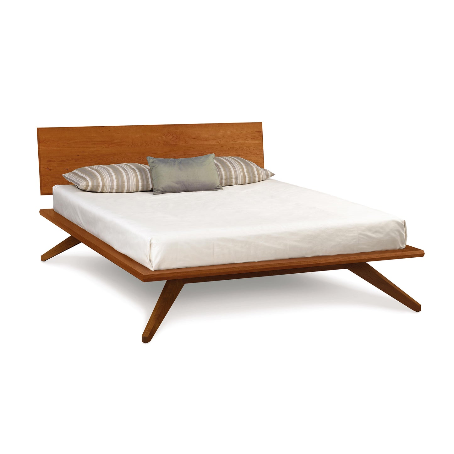 Astrid Platform Bed by Copeland Furniture, mid-century modern with eco-friendly hardwood frame, complementing white mattress and striped pillows.