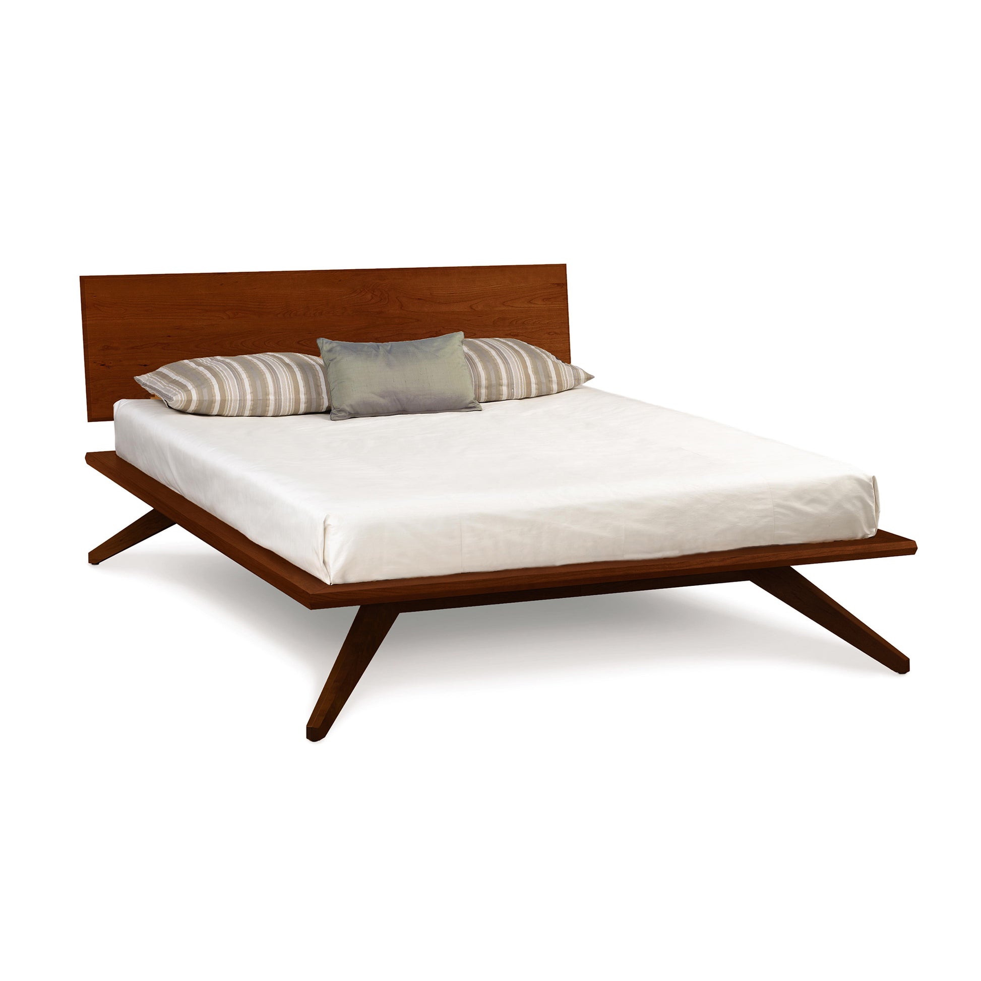 Copeland Furniture Astrid Platform Bed in eco-friendly hardwood with a modern design, featuring a white mattress and stylish gray accent pillow.