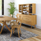 Solid hardwood dining table with four matching chairs and Copeland Furniture's Audrey 2-Door 3-Drawer Buffet in focus.