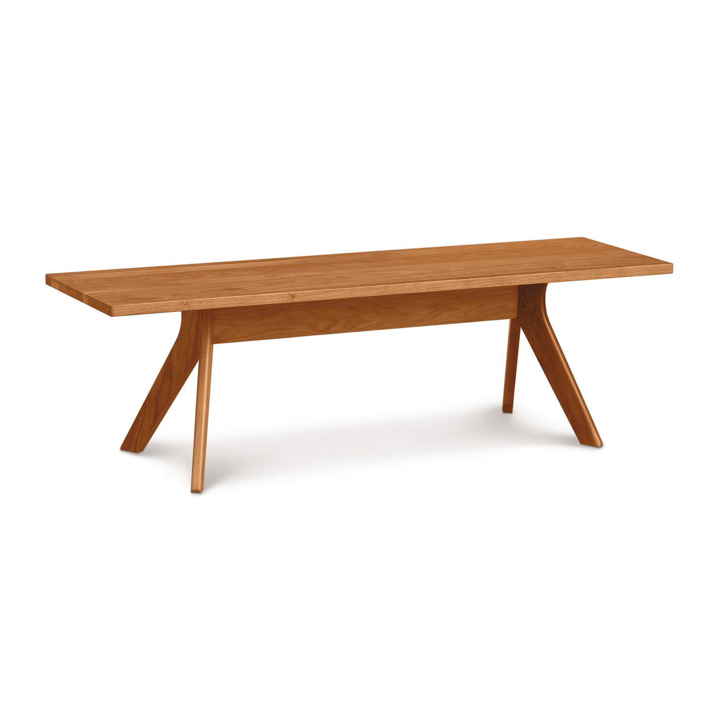 A handmade solid cherry wood Audrey Dining Bench with angled legs on a white background from Copeland Furniture.