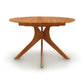 An Audrey Round Extension Dining Table by Copeland Furniture with three legs on a white background.