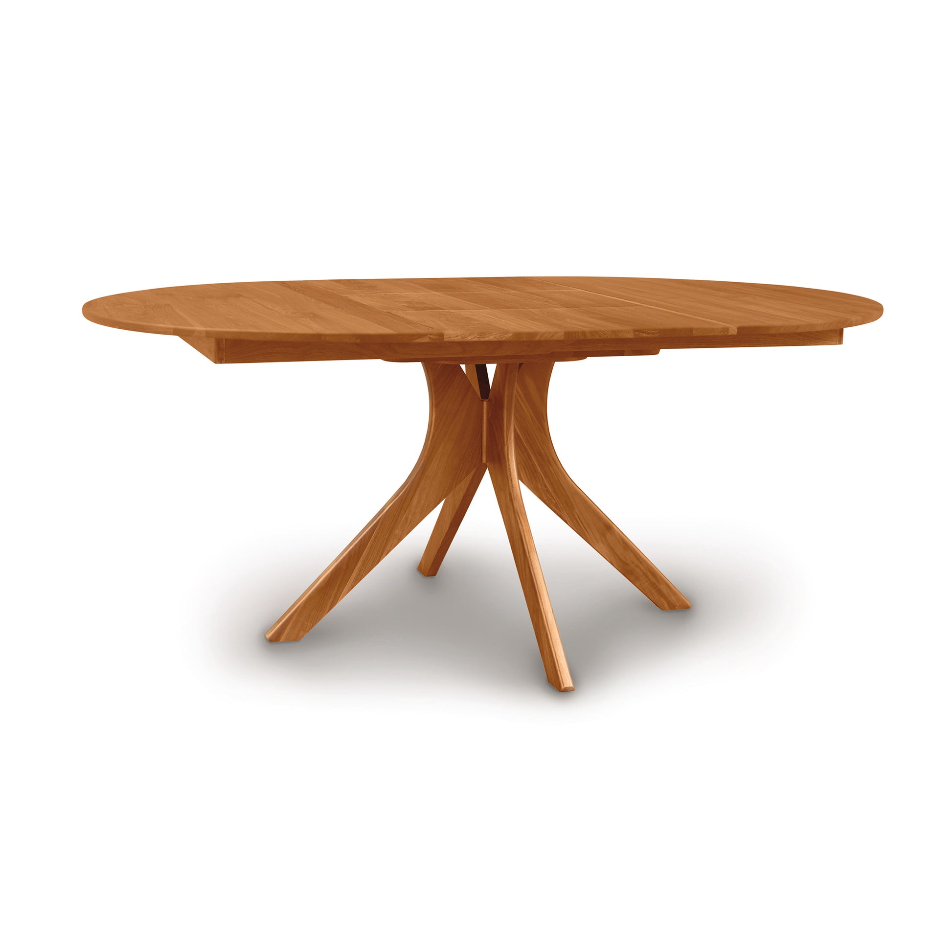 An Audrey Round Extension Dining Table by Copeland Furniture with a star-shaped base, isolated on a white background.