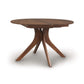 An Audrey Round Extension Dining Table with three legs that is made from solid wood and branded by Copeland Furniture.