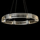 The Hubbardton Forge Aura Glass Pendant is a modern light fixture with a circular glass shade. It is beautifully crafted with hand-forged steel and features layered glass for a stunning visual effect.